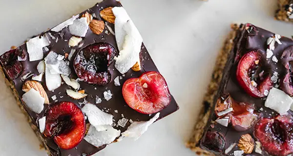 Cherry oat bars on a tabletop
