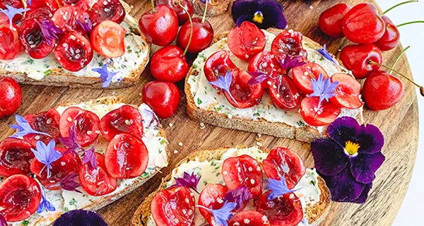Toast with cherry relish on a cutting board