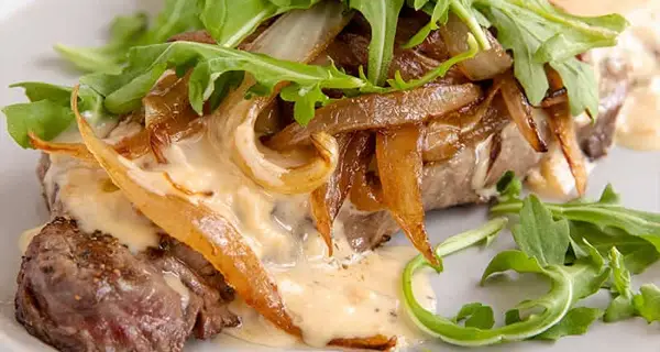 Grilled Steak with Caramelized Onions and Cream Sauce