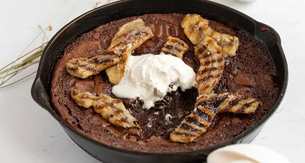 Bananas foster brownie in a skillet