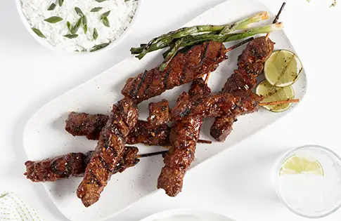 Marinated beef skewers on a plate