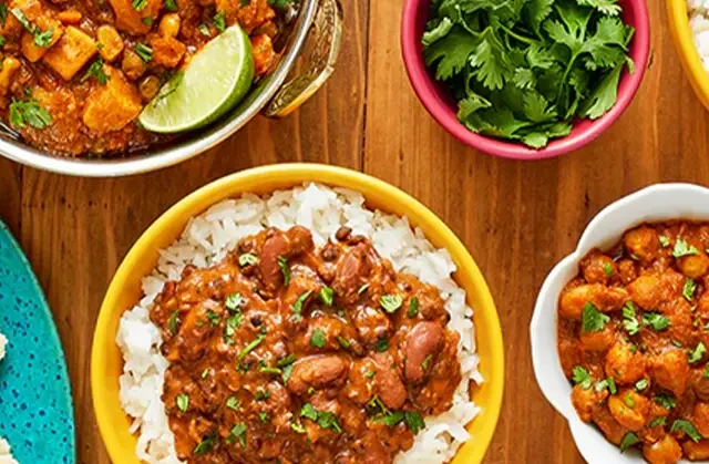 Variety of Tasty Bite products prepared in bowls